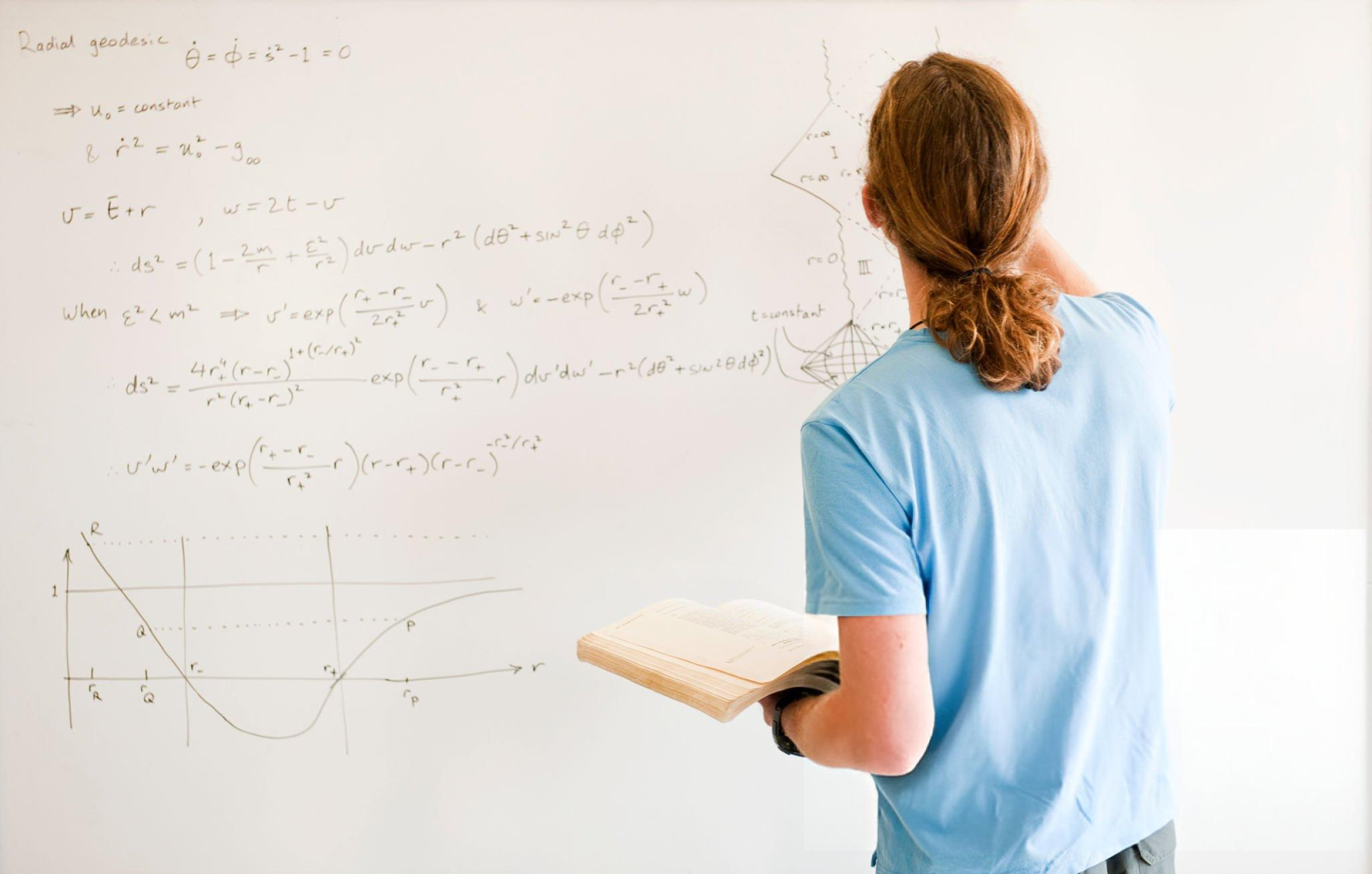 Indian student preparing for Physics Olympiad with advanced equations