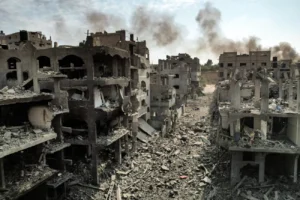 Gaza / modern urban warfare — “Collapsed apartment block with personal items visible”