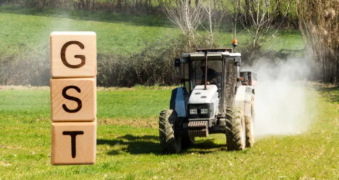 Farmers working in fields as GST reforms reduce input costs for agriculture