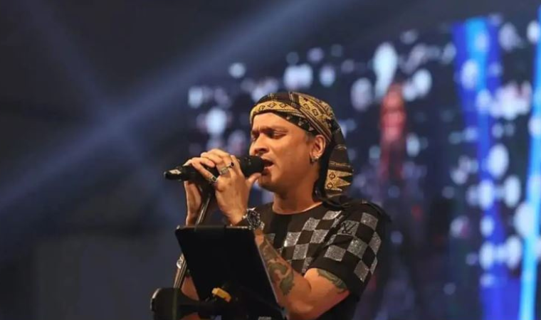 Zubeen Garg singing on stage, inspiring fans in Northeast India