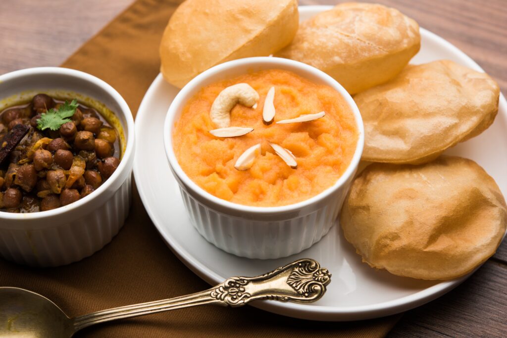 Traditional prasad of halwa puri and black chana prepared for Kanjak Puja during Durga Ashtami