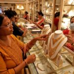 People buying gold jewelry and coins on Dhanteras 2025 for prosperity and good fortune