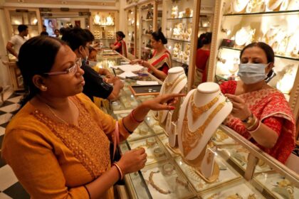 People buying gold jewelry and coins on Dhanteras 2025 for prosperity and good fortune