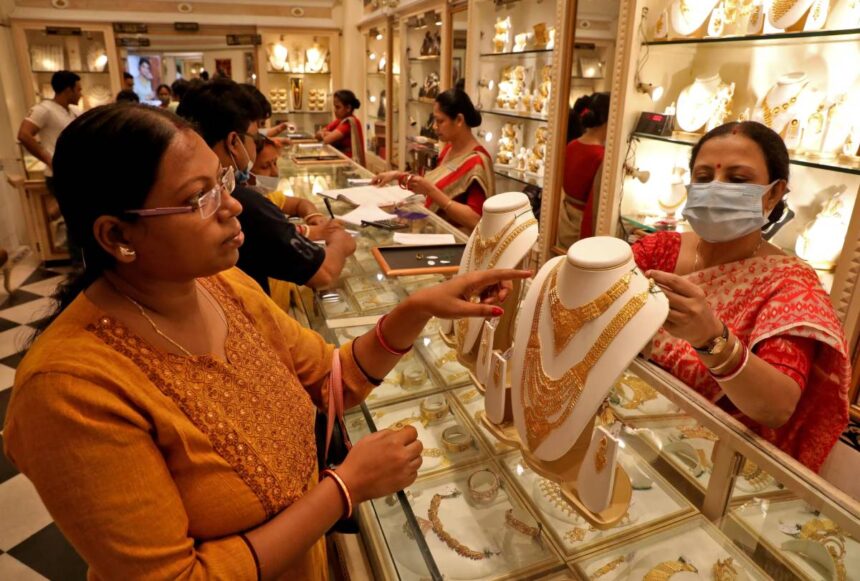 People buying gold jewelry and coins on Dhanteras 2025 for prosperity and good fortune