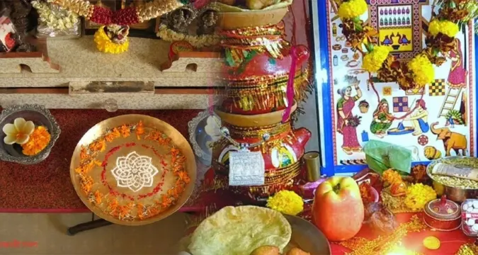 Ahoi Ashtami vrat thali with diya, silver idol, and festive sweets before puja