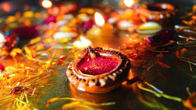 Handmade clay diyas and candles illuminating homes during eco-friendly Diwali 2025