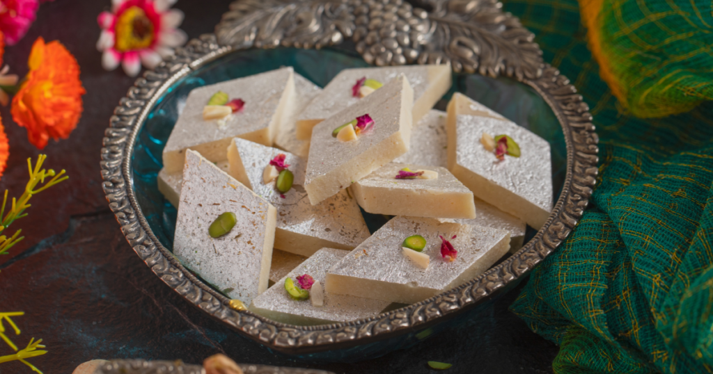Diwali sweets arrangement with kaju katli, ladoos, barfi