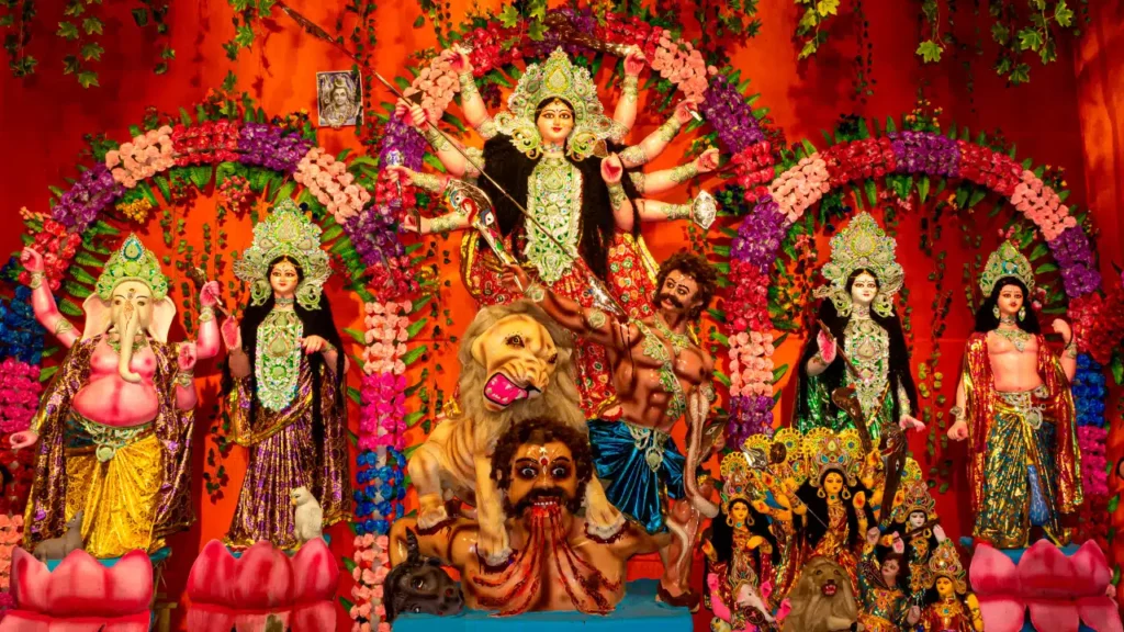 Married women celebrating sindoor khela with red vermilion during Durga Puja in Kolkata