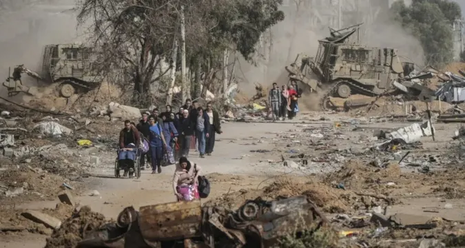 Palestinian residents inspect the ruins of homes destroyed in overnight Israeli air raids