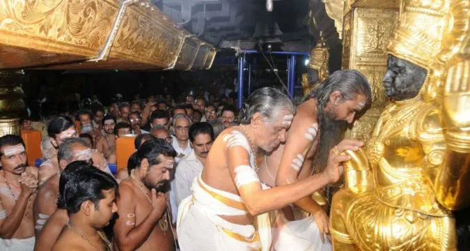 Temple priest opening Sabarimala sanctum during annual rituals