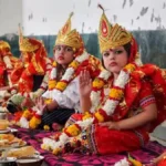 Women performing Pushpanjali and Kanya Puja rituals on Durga Ashtami 2025 in India