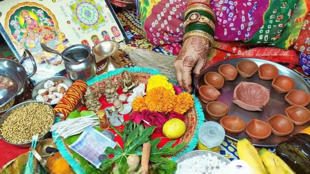 Devotees performing the Dhanteras pooja, lighting diyas and offering prayers to Goddess Lakshmi and Lord Dhanvantari for prosperity and wellness.