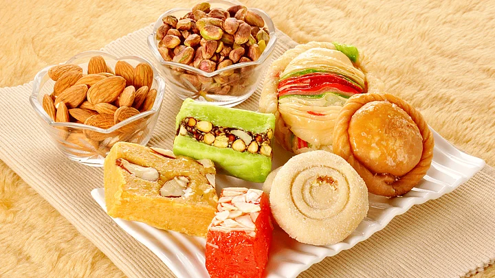 Indian family celebrating Diwali together with sweets, diyas, and laughter