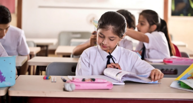 Children reading books in classroom India education