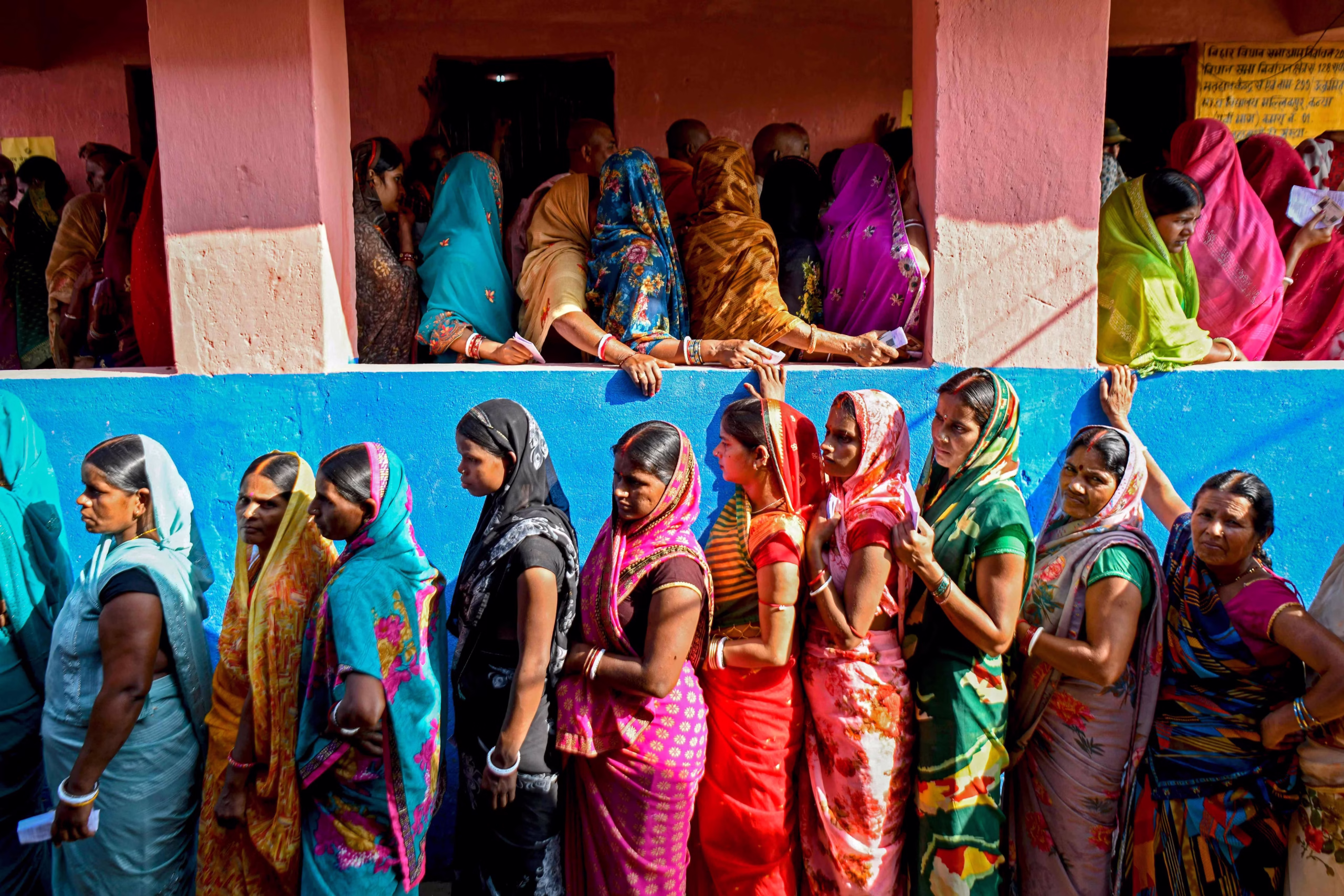 Voters stand in long queues outside a polling booth during the final phase of Bihar Assembly Elections 2025.