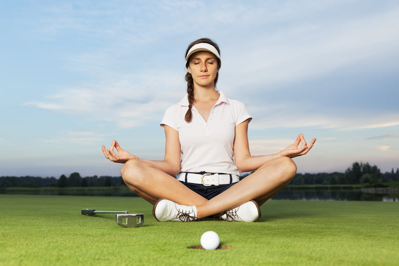 Golfer focusing before a shot showing mental discipline and concentration