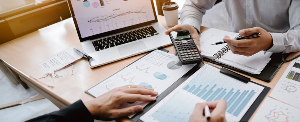 Young professionals analyzing stock market charts and investment options.