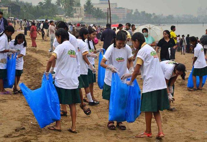 Collecting plastic waste during a cleanliness drive in India