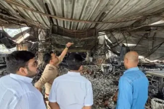 Police and forensic teams inspecting the burnt interiors of the nightclub in Goa