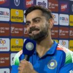Virat Kohli celebrating a historic milestone in international cricket