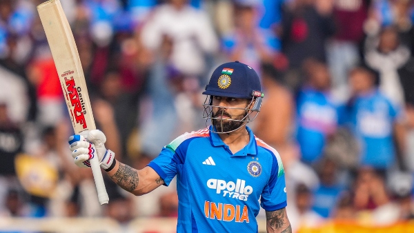 Virat Kohli raising his bat after reaching another milestone