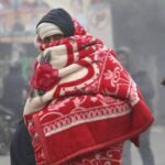 Dense December fog covering a North Indian city as winter 2025 shows unusual temperature changes.