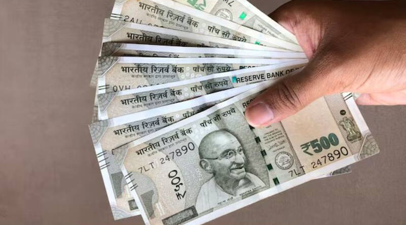 Middle-class Indian family discussing household expenses and monthly budget at home