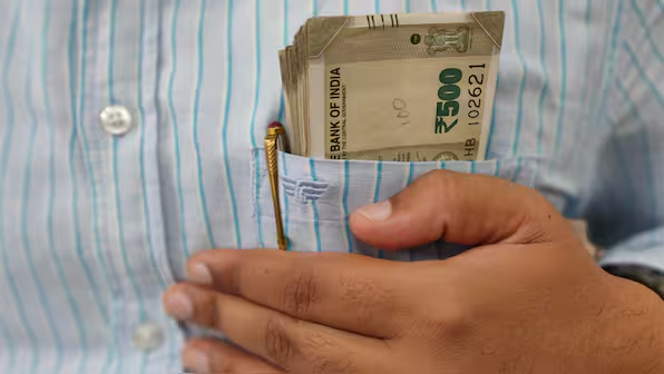 Indian office worker stressed about job security and financial responsibilities