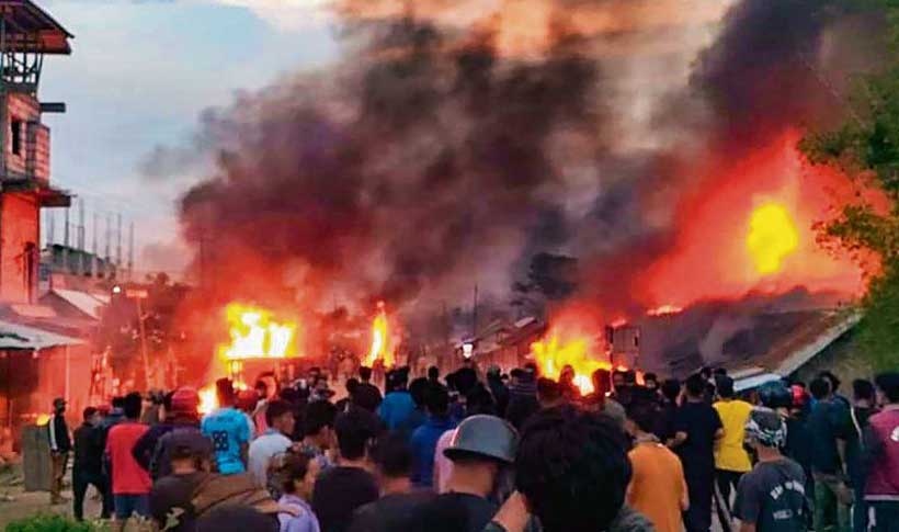 Burnt houses after ethnic clashes in Manipur hill district