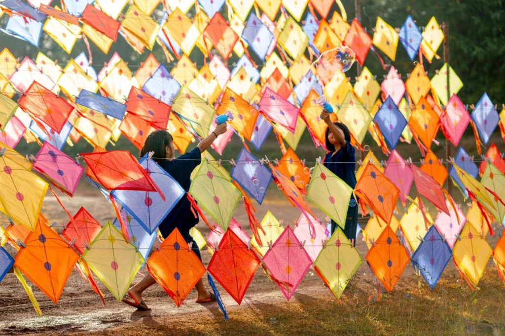 People flying kites during Makar Sankranti celebrations in India