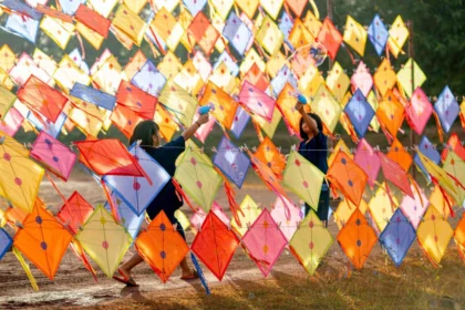 People flying kites during Makar Sankranti celebrations in India