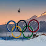 Winter Olympics stadium decorated with Olympic rings during competition