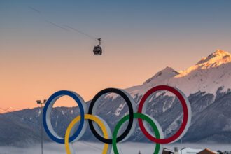 Winter Olympics stadium decorated with Olympic rings during competition