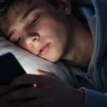 Teen scrolling social media at night showing brainrot effect and digital fatigue