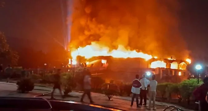 Firefighters responding outside a damaged Goa nightclub after the late-night fire incident