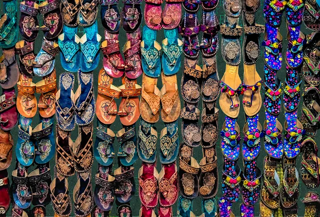 Indian artisan crafting traditional Kolhapuri sandals, a design copied on global runways