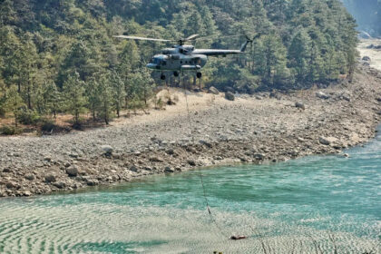 Indian Air Force helicopter conducting firefighting operations during forest fire in Arunachal Pradesh