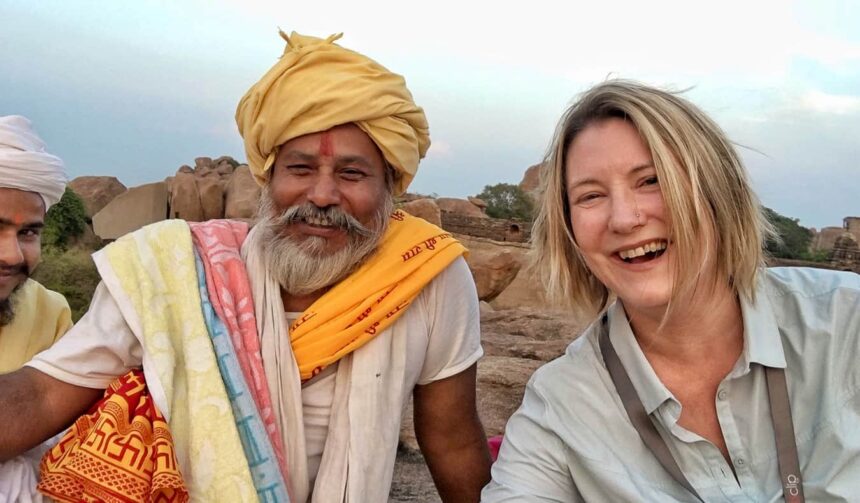 Travelers sharing stories and meals with locals in a rural village, representing empathy and cultural exchange through travel.